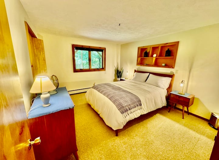 Downstairs 3rd Bedroom with double bed and window overlooking backyard.