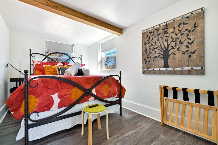Front bedroom with luxury Queen bed, rolling side stands and a standing wardrobe
