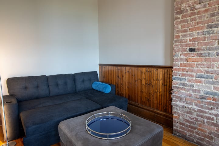 The 2nd sleeping area is located in the corner of the main area and is a full-size futon. A privacy screen provided for your use. Sheets, blankets and pillows are provided in the lift-up cushion of the futon.