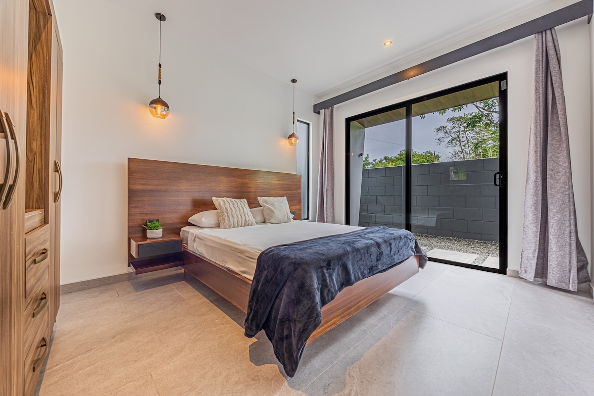 The second bedroom features a queen-size bed, dedicated A/C and closet