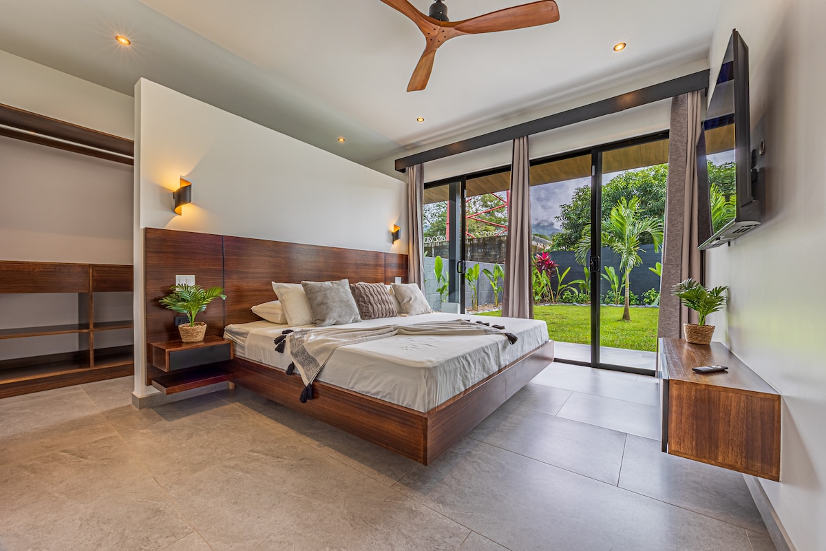 The master bedroom features a king-size bed, dedicated A/C, ceiling fan, private en-suite bathroom, Smart TV, closet and  direct access to the pool area!