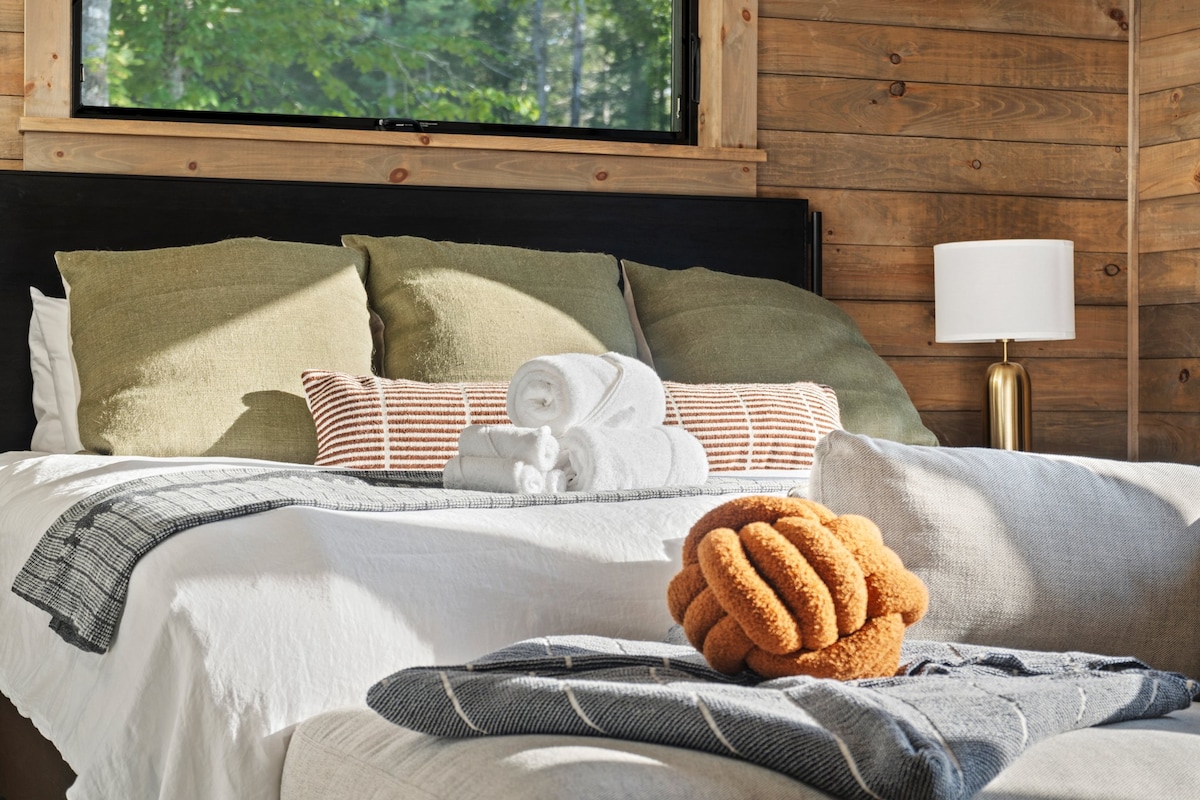 Luxurious bedding and design await you in the master suite