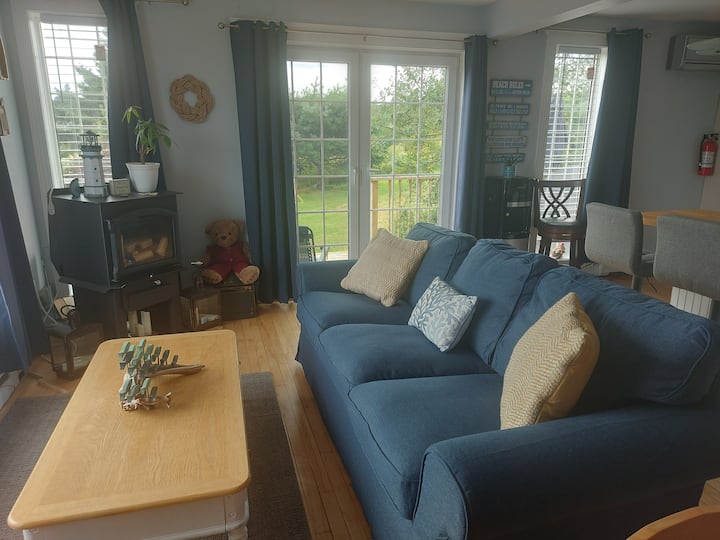 Bright and airy living room. Sit back and relax on the comfortable sofa 