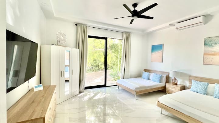 Two double-beds sleeps up to 4 guests. Garden view on ground floor with balcony. 