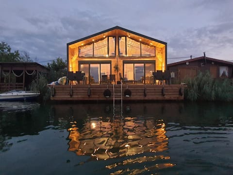 Modern river house with sea view