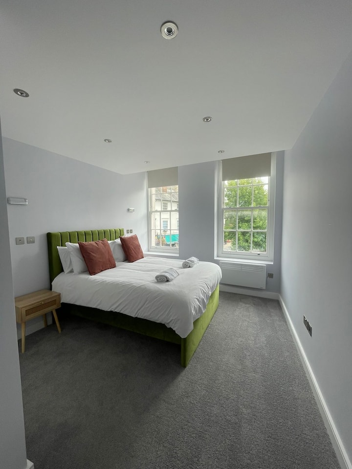 Relax and unwind in stylish comfort in Bedroom 1 with a luxurious king bed, soft beddings, and plush towels - your perfect sanctuary for a restful night's sleep!