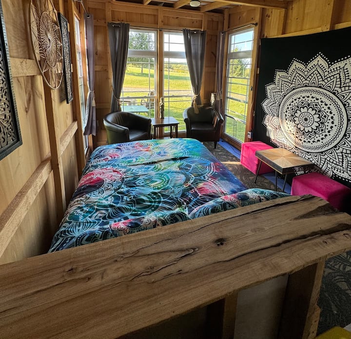 Queen sized bed with fresh sheets and fluffy blankets. 