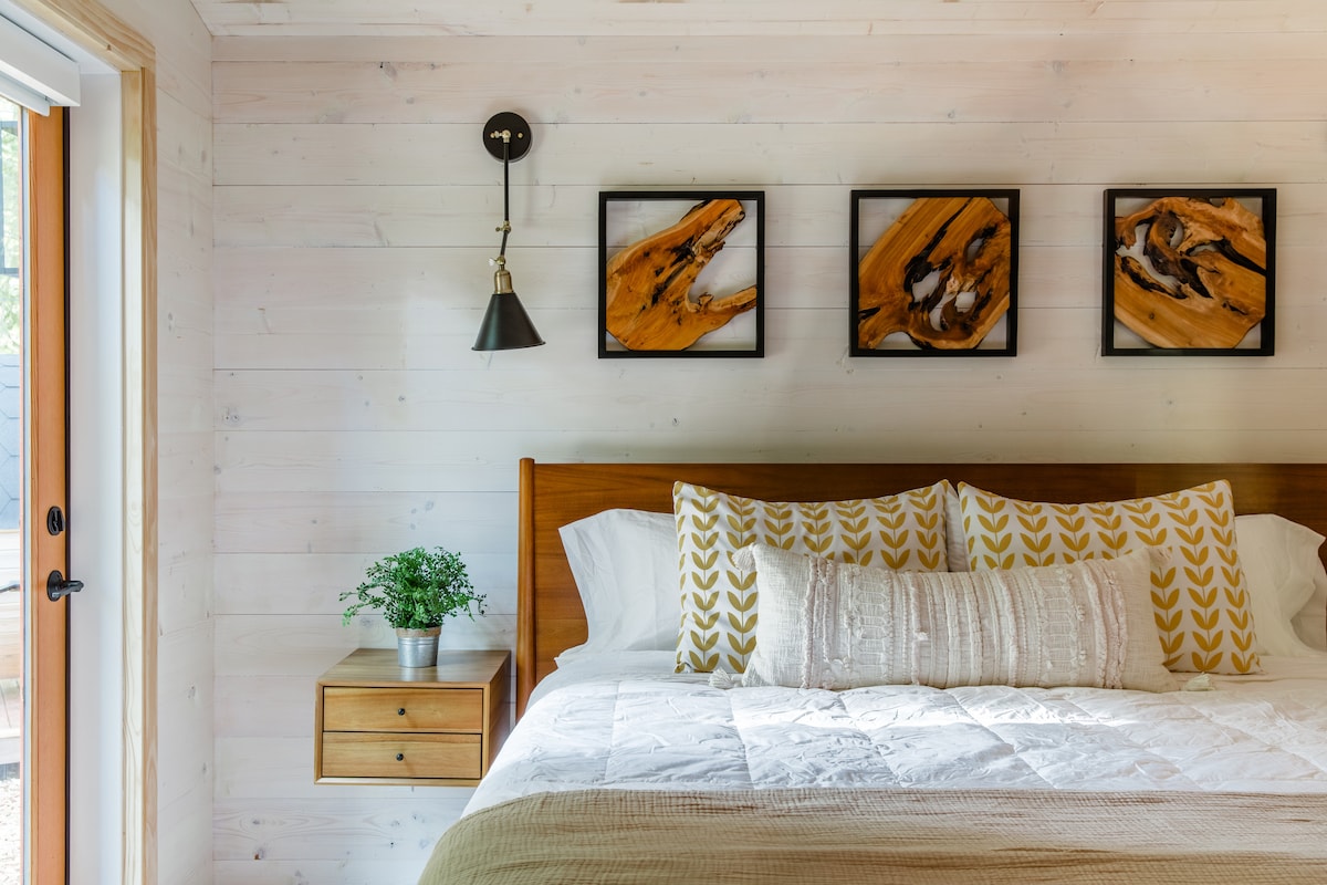 The king size bed, Helix mattress, 100% cotton Pottery Barn sheets, and blackout shades make for an exceptionally restful sleep.