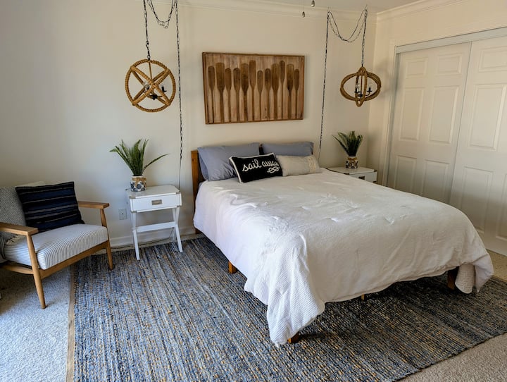 Sail away in this beautifully decorated downstairs bedroom with private exterior and interior access, a queen size bed and an ensuite.