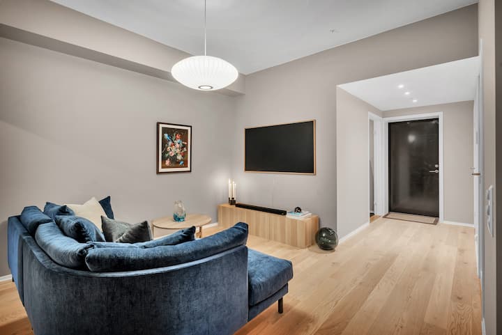 The TV lounge. The room features a 65" TV with Dolby Atmos Sound System and a comfortable sofa, so you can sit back and relax with a quality movie during the winter storms.