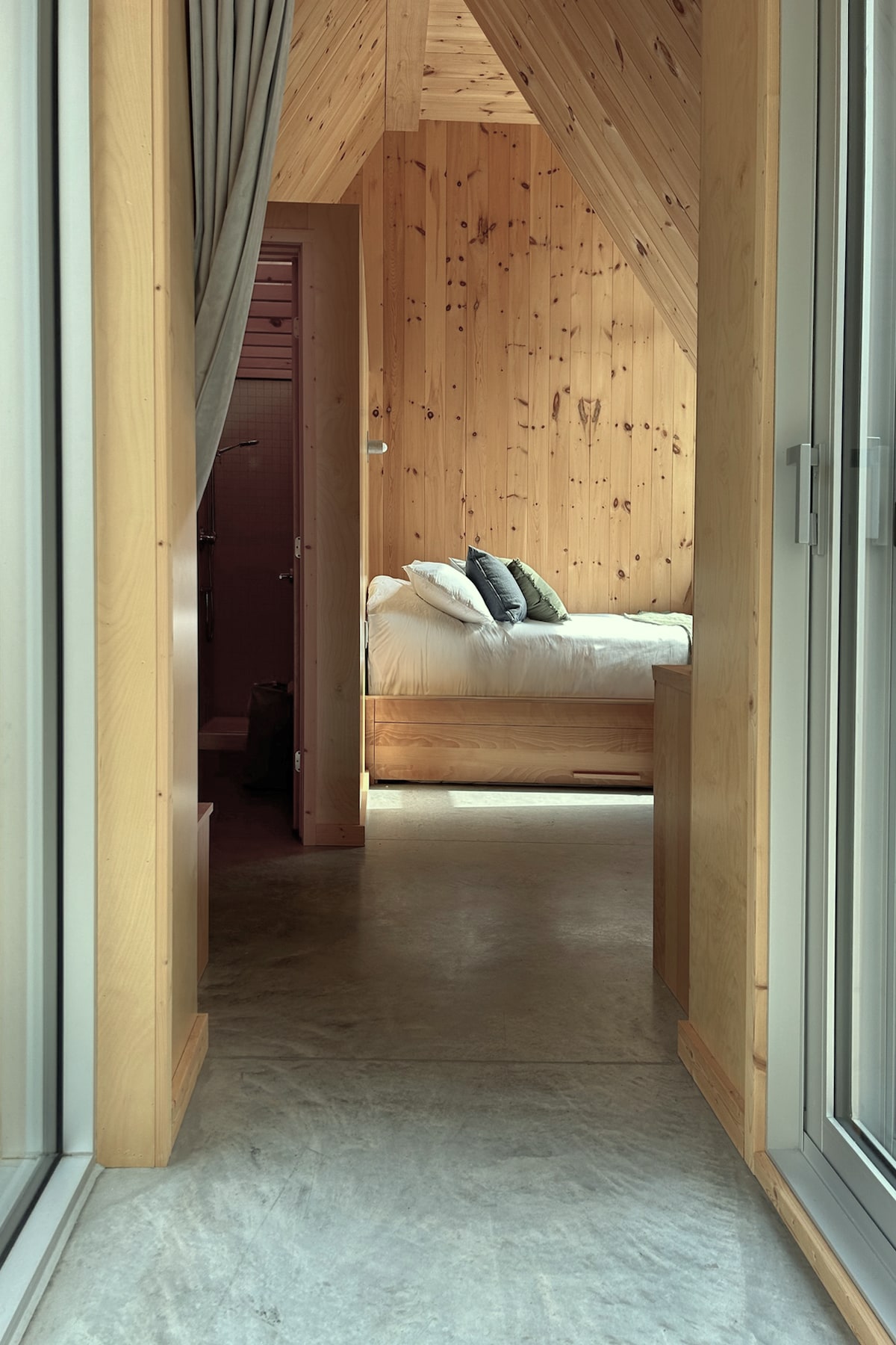 Room and secluded bathroom from the building.