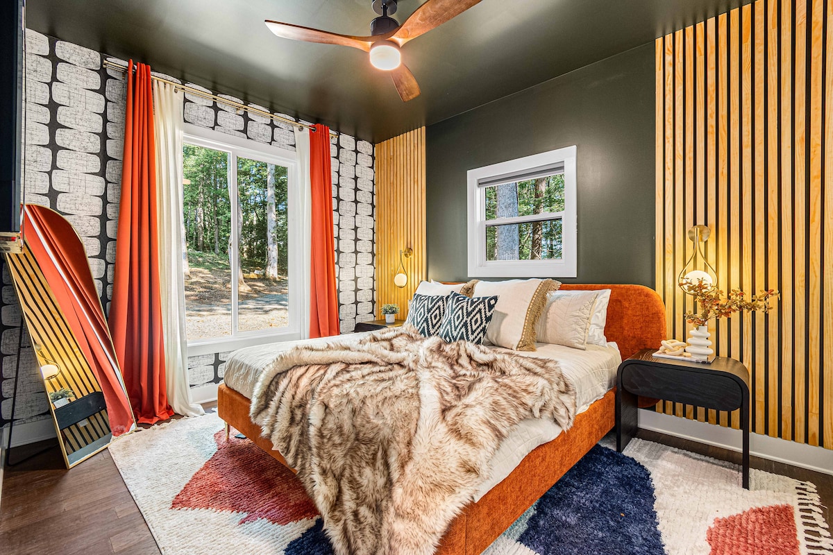 Bedroom 2 with comfortable king bed, premium sheets, blackout curtains, closet, TV.