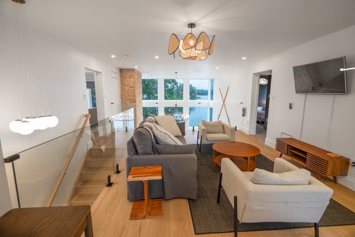 Loft on 3rd floor overlooking 2nd floor living room with view of waterfront. Loft features a queen sized pull-out and TV. 