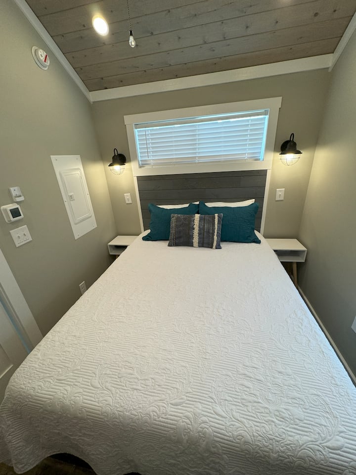 Queen bed in bedroom.