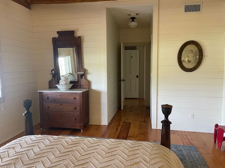 Antique furniture helps you step back in to the simpler times of the past. Hallway has a walk-in closet as it leads leads to bathroom.