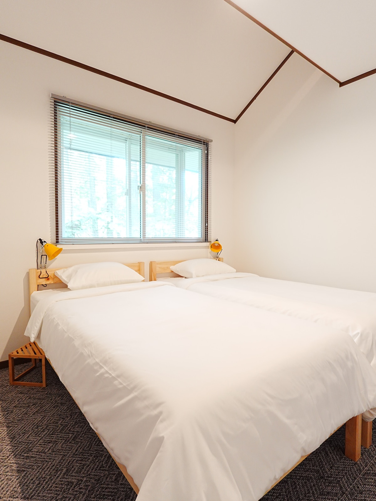 Each bedroom has two twin beds, loft storage, and an en suite sink and toilet