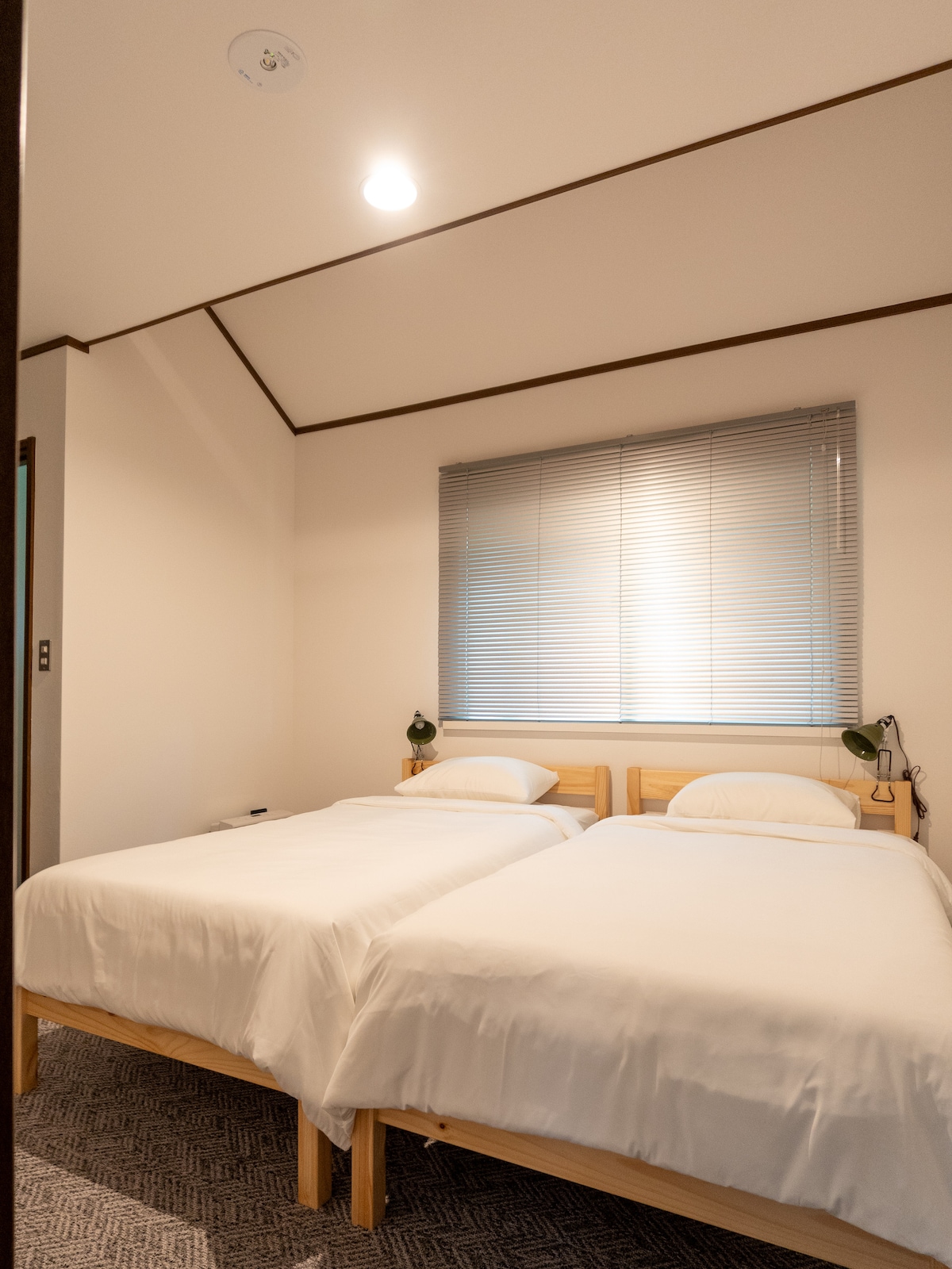 Each bedroom has two twin beds, loft storage, and an en suite sink and toilet