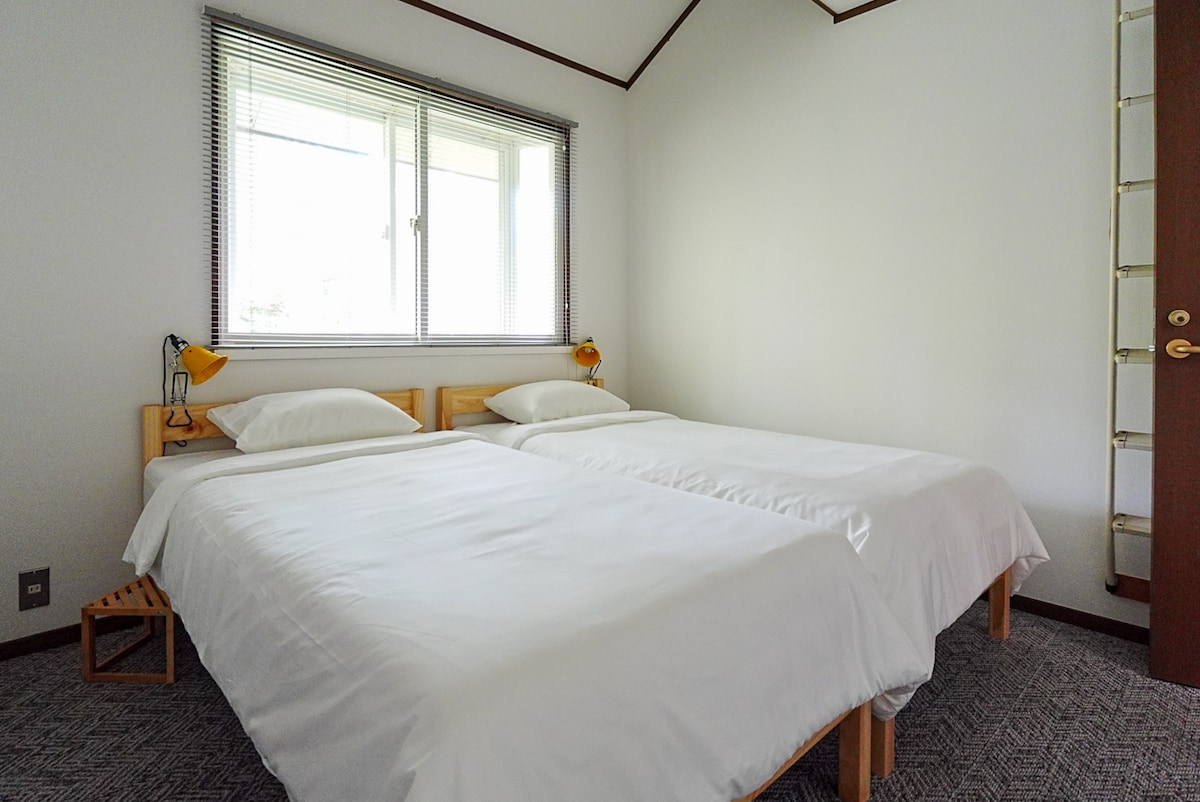 Each bedroom has two twin beds, loft storage, and an en suite sink and toilet