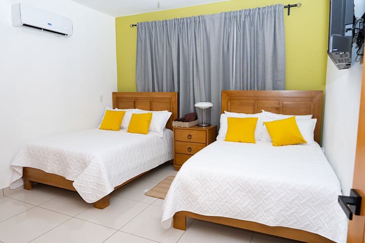 ห้องพักพร้อมเตียงคู่ 2 เตียงตั้งอยู่ในหมู่บ้านโบนิตา 2