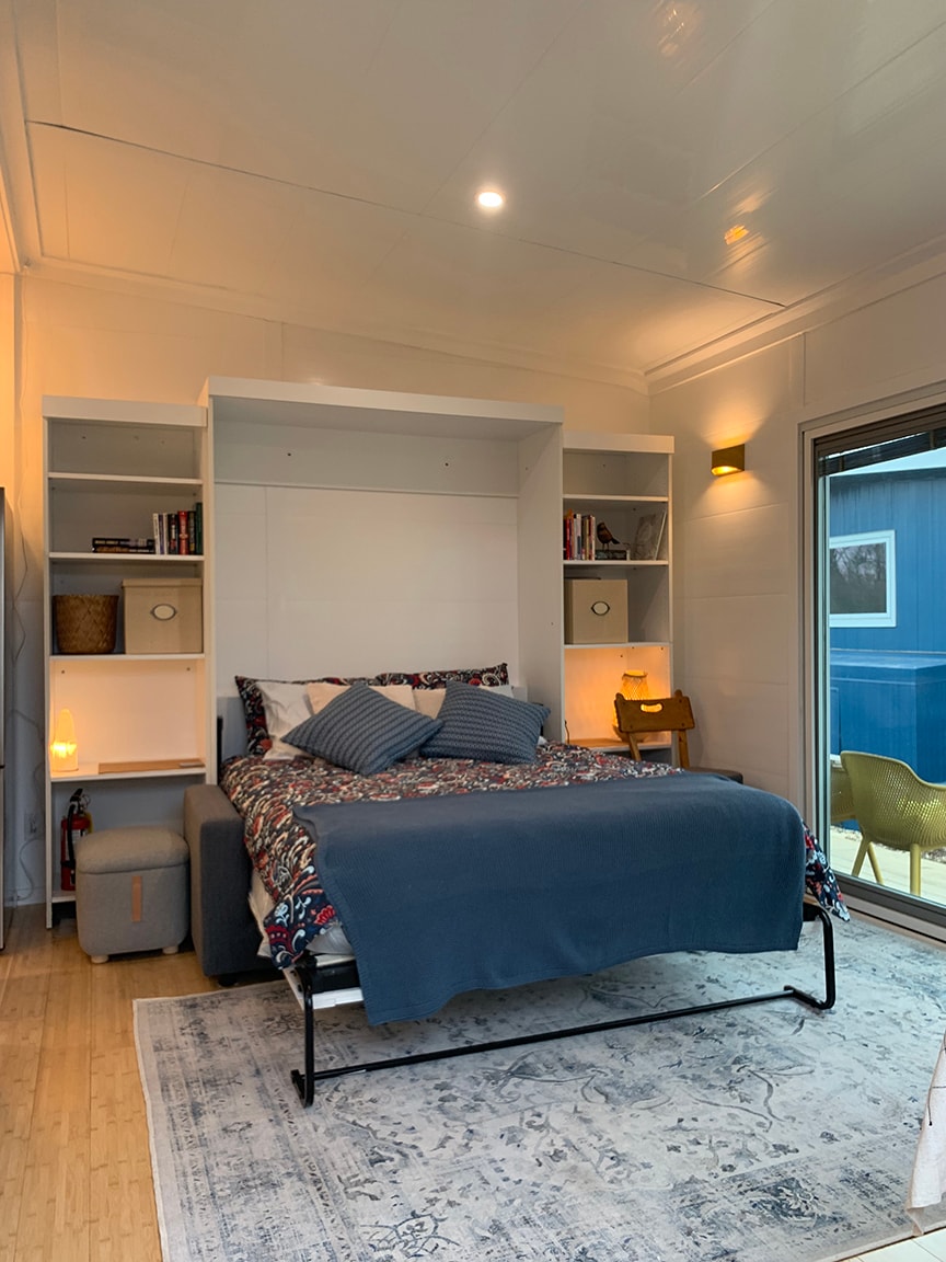 Murphy Bed is in full sleeping mode. 
**Note placement of supporting metal foot under the end of the bed. Full instructions are available in the suite. 