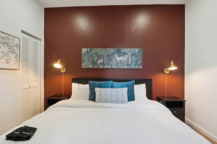 2nd floor King bedroom en suite with linens, TV, dresser and closet.