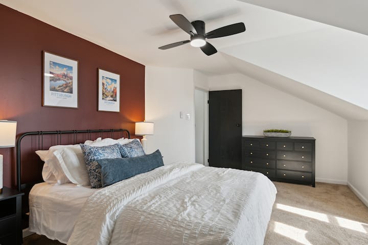 3rd floor Queen bedroom with linens, TV, dresser and closet.