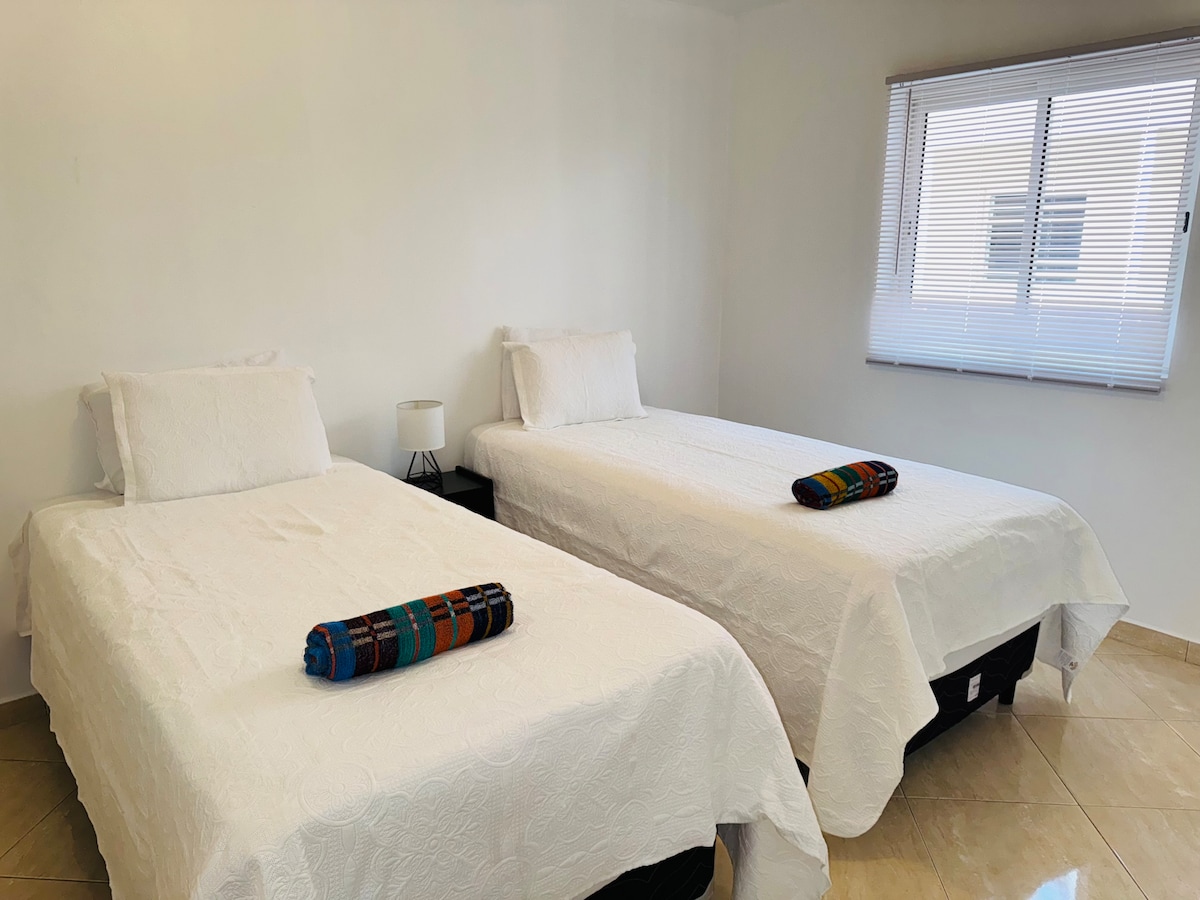 2x Twin XL downstairs. The two twins can be pushed together and become a king