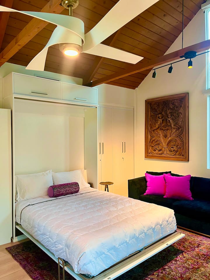 Murphy bed pulled down, pillows and sheets provided.
