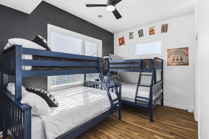 Unit #1: Two comfortable twin-over-queen bunk beds in bedroom #3 upstairs. Plenty of closet space for your clothes in this room, plus a ceiling fan.
