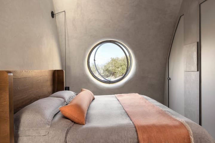 Primary suite featuring center pivot circular window