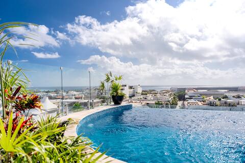 Popular Airbnb listing: Centric | Rooftop Pool w/ Ocean View | Casago in Xaman Ha