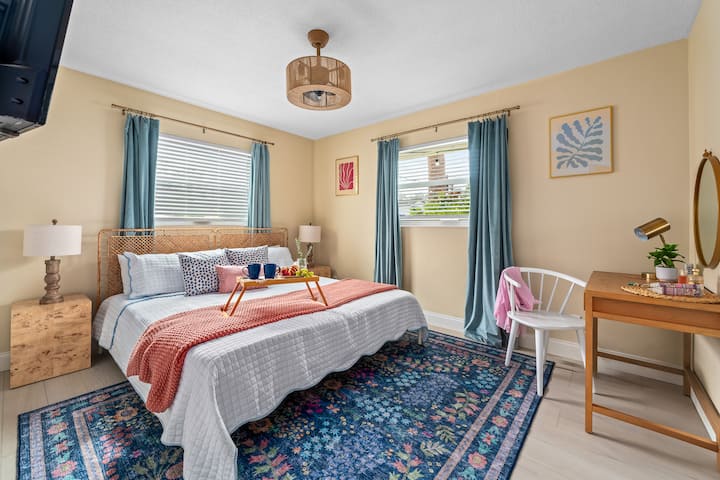 Primary bedroom: Unwind in a luxurious King bed with a plush mattress topper; stay productive with a remote workstation. 