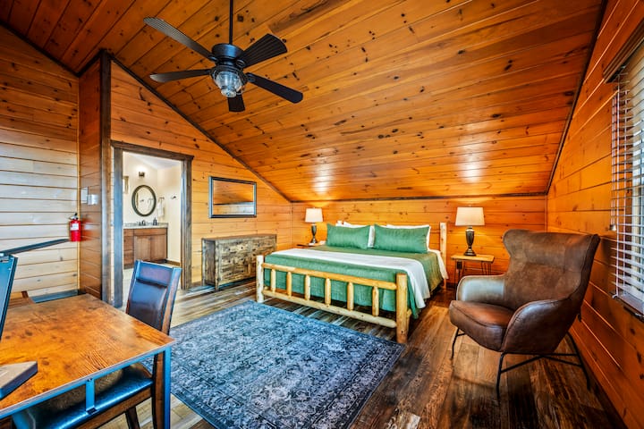 King Bedroom Upstairs with dedicated work space, Smart TV with adjoining bathroom and adjoining Queen Bed and Double Bed



