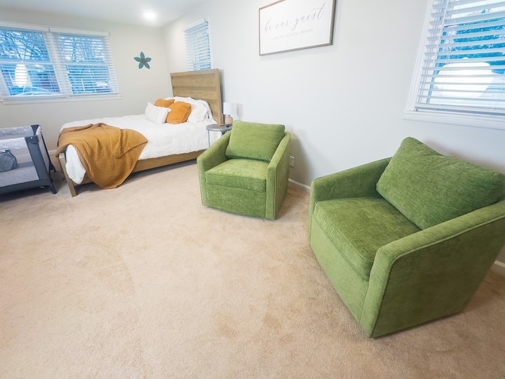 Relax & Unwind – Enjoy a cozy sitting area with two comfortable chairs, perfect for sipping coffee, reading, or winding down after a long day.