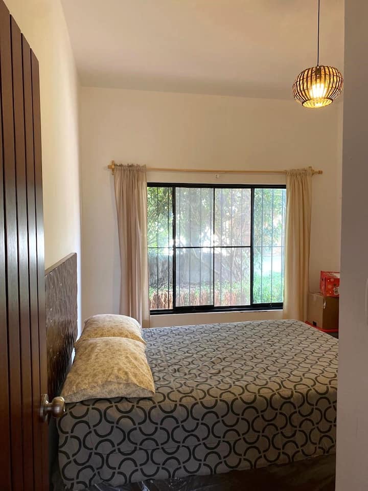 This room has a double bed for two people and an extra single bed. Also a full bathroom outside the room for exclusive use.
