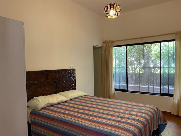 This room has a double bed for two people and an extra single bed. In addition to a private full bathroom.
