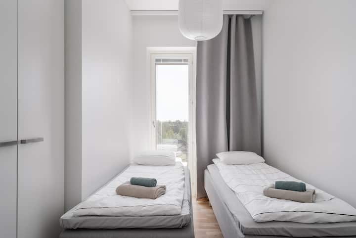 Dos camas individuales para una cómoda noche de descanso.