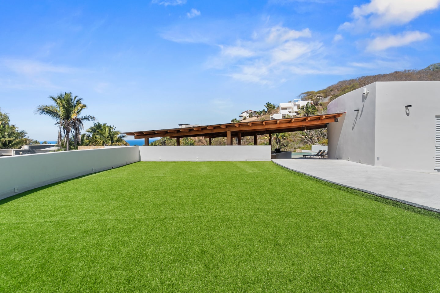 Roll out your mat on the rooftop turf for morning yoga, or simply stretch out under the palapa with an ocean glimpse through the trees.