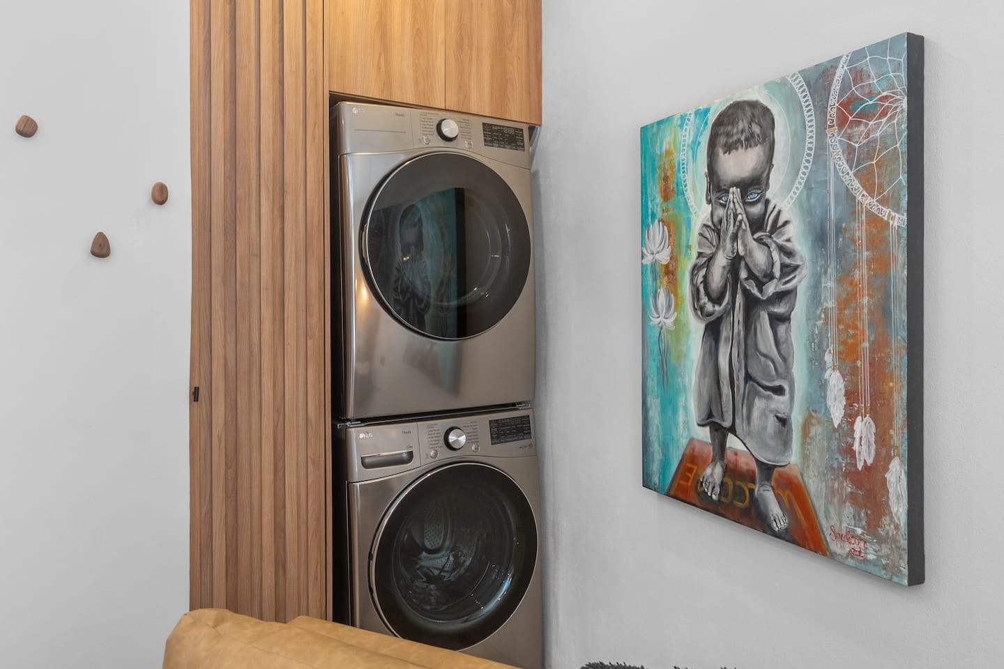 Do your laundry in the in-unit stacked washer and dryer tucked in a wood-paneled alcove. No shared laundry, no waiting.
