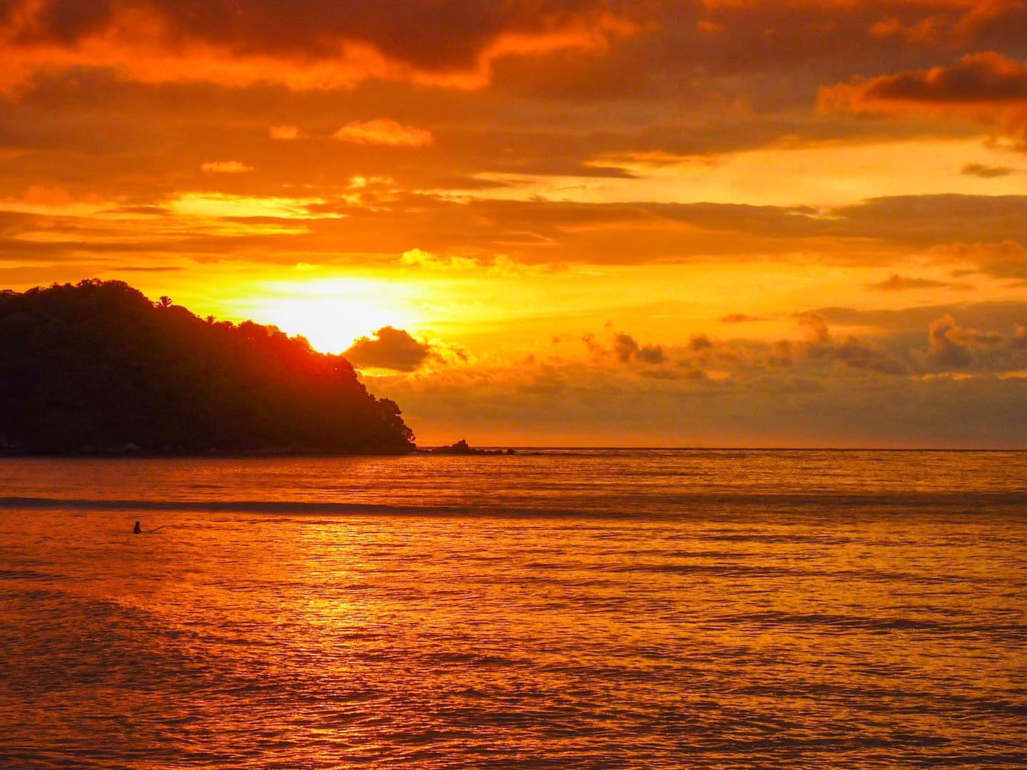 Watch the sun sink below the Pacific headland in a blaze of orange. Every evening ends like this from the rooftop.