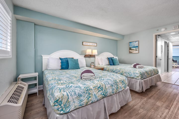 Beautifully appointed bedroom with two comfortable queen beds 
