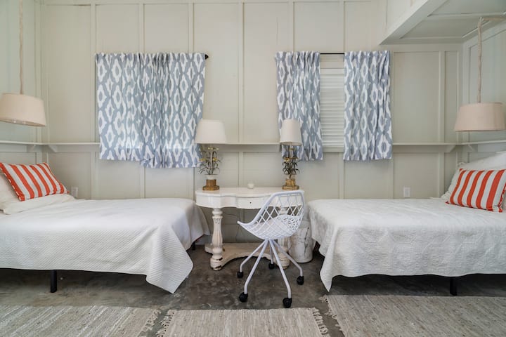 Ground floor bunkroom (6 twin beds, ensuite bathroom, 2nd laundry area).  NOTE:  Access to bunkroom requires exiting main house via the breezeway and to enter the bunkroom.  It may not be your choice for smaller children.  Bring monitor if required.