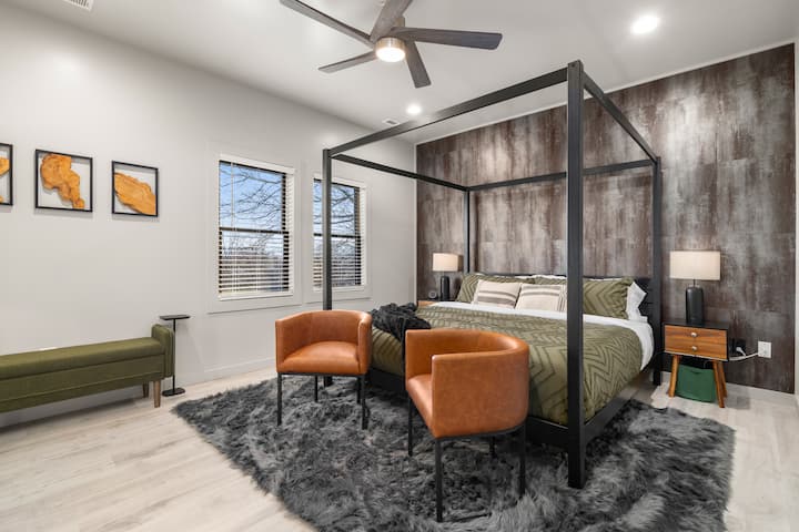 Master Bedroom Retreat: Stylish four-poster bed with artisan decor and mountain views awaits!