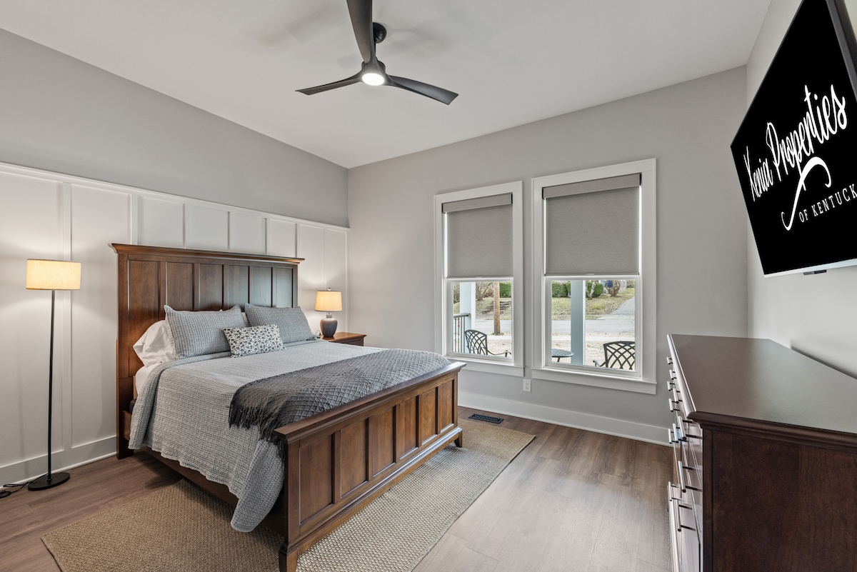 Inviting bedroom just off the living room and beside the main bath. Features a plush queen bed, 55" smart TV, and stylish decor—perfect for unwinding after a day exploring Georgetown or relaxing with your favorite shows.