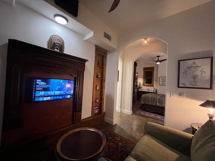 Living room with TV, which also has a sofa bed. 
