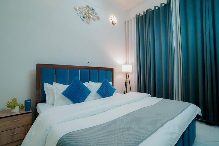 "How does this cozy blue bedroom make you feel – relaxed, refreshed, or both? "
