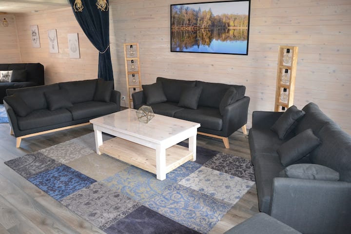 Large, bright and cozy room, consisting of a living room area and a bedroom area, which can be separated by thick curtains (2 doors, 3 windows).