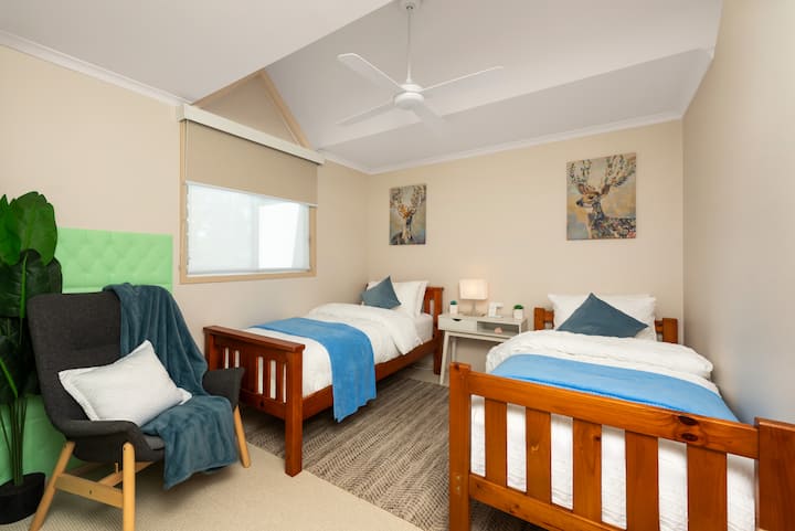 A great room for the kids or singles with two single beds looking out to the tennis court.