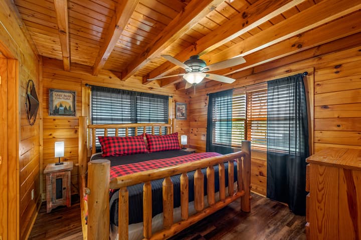 Cozy up in your private king bedroom—solid log furniture, soft linens, and warm cabin charm