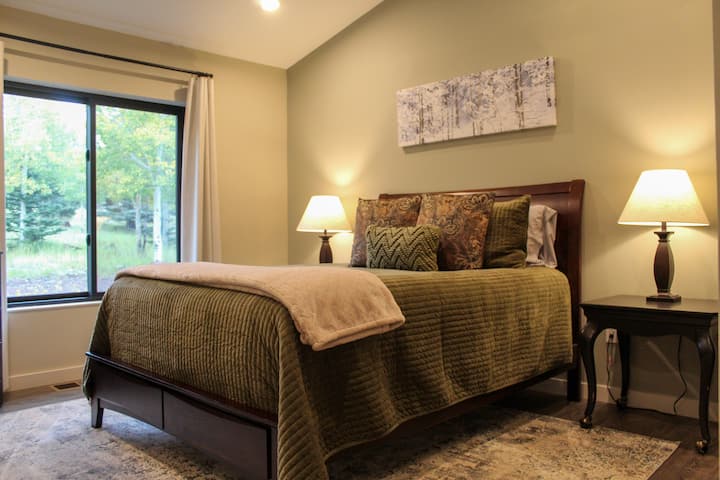 The guest bedroom is designed to provide unparalleled comfort equipped with a queen-sized bed. Conveniently stored in the bedroom closet is an air mattress, perfect for inflating in the living room to accommodate extra guests